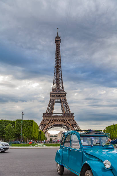 View at vintage car by Eiffel tower in Paris, France