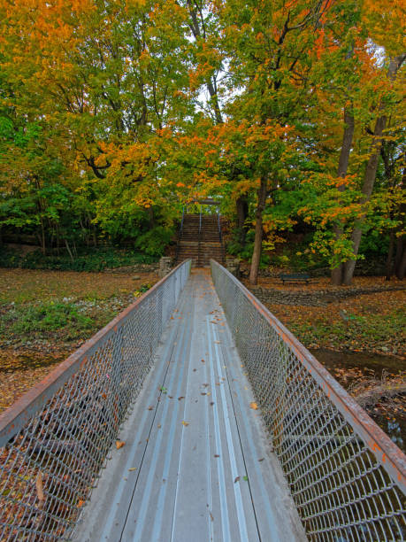 istock Fall Colors with a Walking Bridge-Howard County Indiana 1280053571