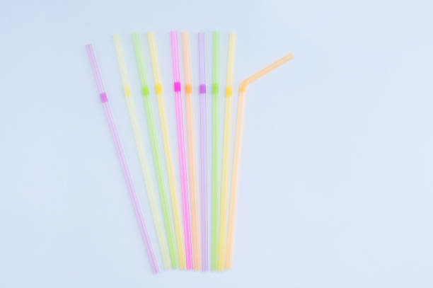 istock Plastic multicolored cocktail tubes in lying on white background. 1280054168