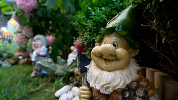 istock Happy garden gnome in a green garden 1280055678