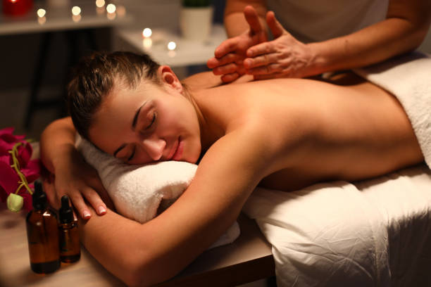 istock Masseur give wellness back massage to client in spa center. 1280059278