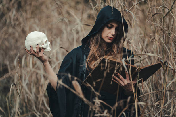 Young witch, preparation for the ritual in the woodlands