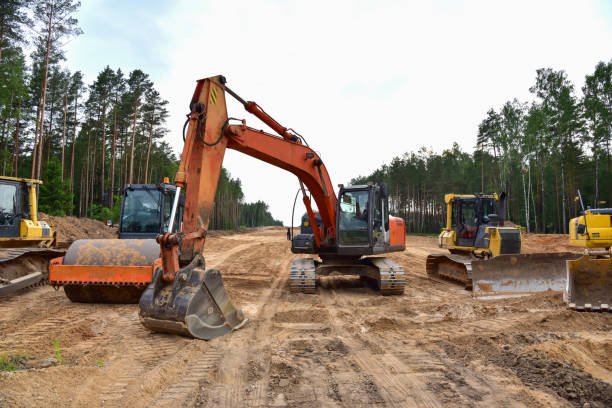 istock Bulldozer, Excavator and Soil compactor on road work 1280061773