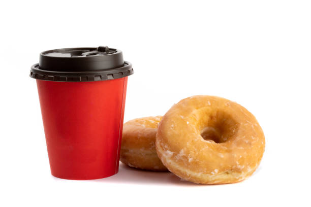 istock two honey dipped donuts beside a red take away coffee cup isolated on white 1280064958
