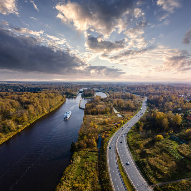 A highway along the river at sunset