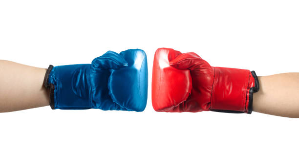 istock Red and blue boxing gloves punching. 1280069727