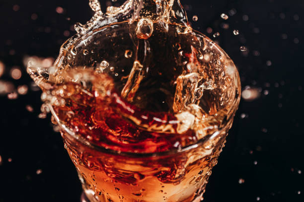 istock Liquid spillng in glass. 1280070875