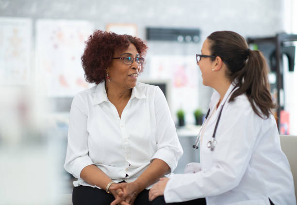 istock Senior consulting with doctor 1280077042