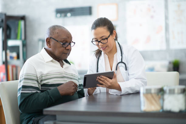 istock Senior consulting with doctor 1280077048