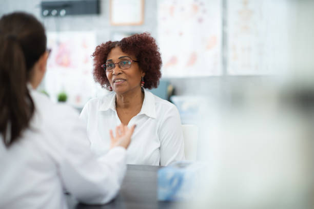 istock Senior consulting with doctor 1280077049