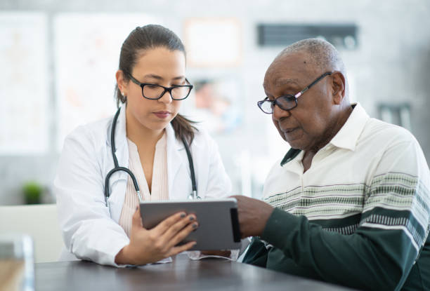 istock Senior consulting with doctor 1280077053