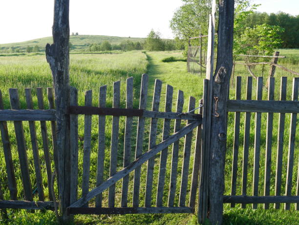 istock Old village fence with a gate. From wood. 1280077335