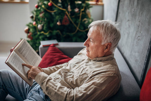 istock One senior man reading a book at home 1280080162