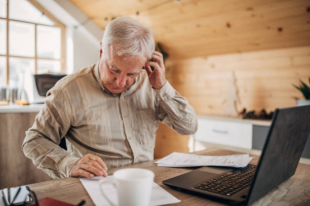 istock One senior man doing some paperwork at home 1280081540