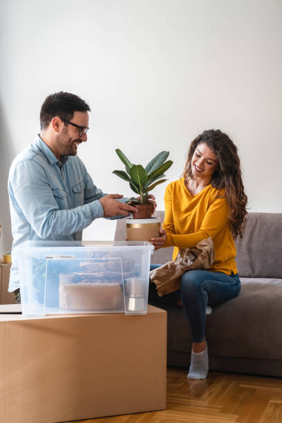 istock Husband and wife unpack boxes stock photo 1280084334