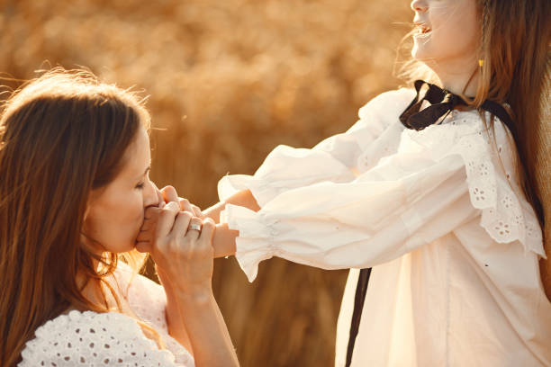 istock Mother with daughter in a wheat field 1280086031