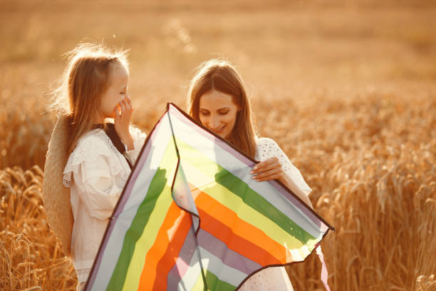 istock Mother with daughter in a wheat field 1280086066