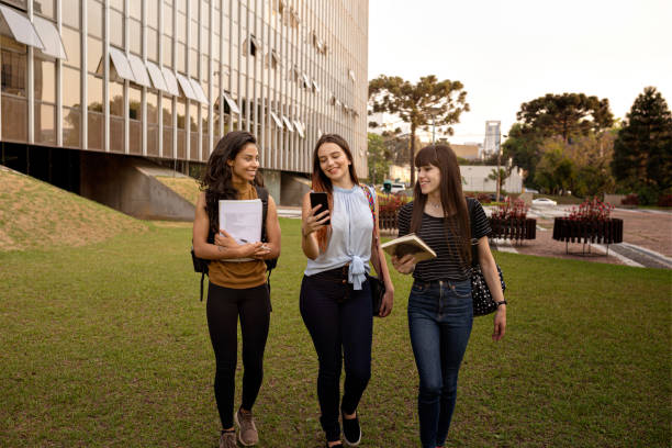 istock Young women relaxing at university campus 1280086957