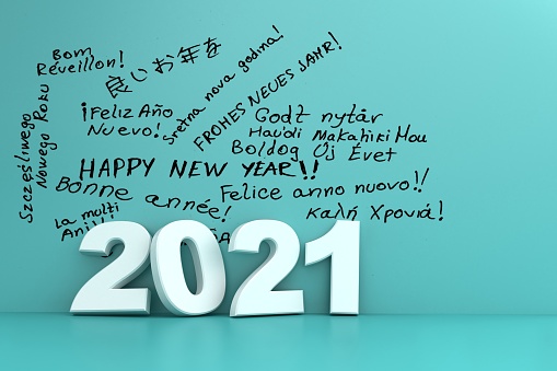 Happy New Year 2021. white numbers in front of happy new year written in many languages on a blue wall.