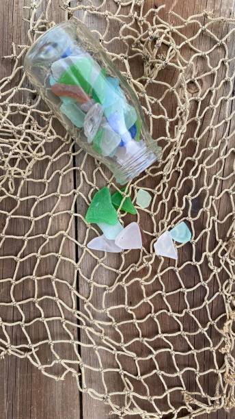 istock Sea glass fragments in bottle 1280089640