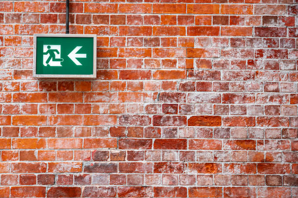 fire exit sign and exit - guidance direction arrow sign speed imagens e fotografias de stock