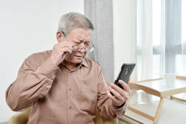 istock Old people looking at cell phone 1280091141
