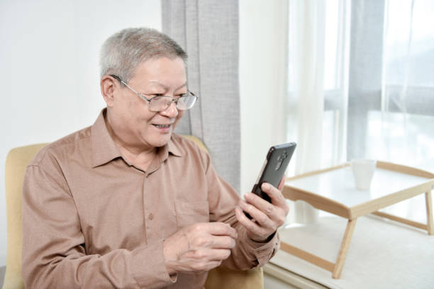 istock Old people looking at cell phone 1280091162