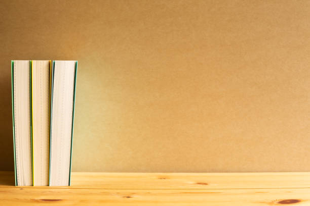 istock Books on wooden desk with brown background 1280091920
