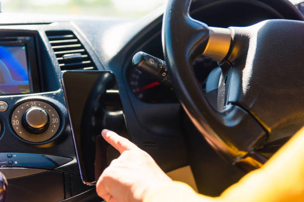 istock woman inside a car and using touch screen on mobile smartphone 1280095809