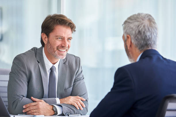 istock Businessmen discussing in office 1280097880