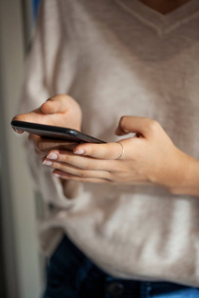 istock Young woman using smart phone 1280098847