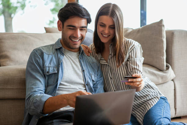 istock Couple doing online shopping on laptop 1280098946