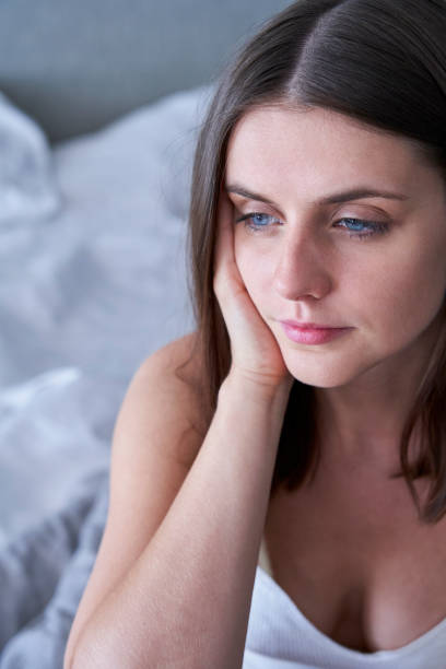 istock Woman with hand on face 1280098977