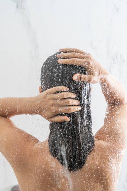 istock Woman bathing under shower 1280099001