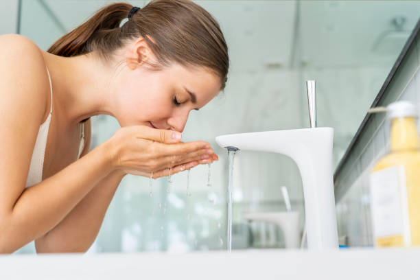 istock Woman washing her face 1280099008