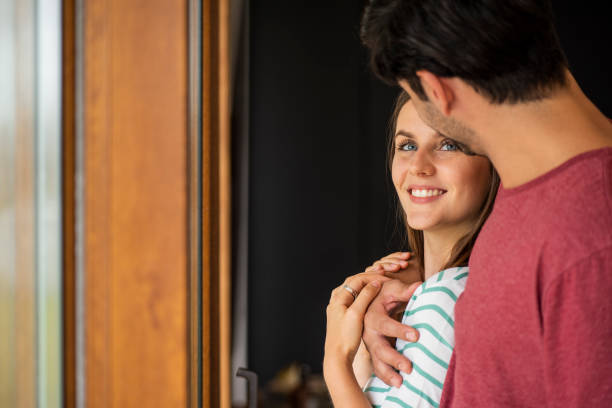 istock Couple standing indoors 1280099212