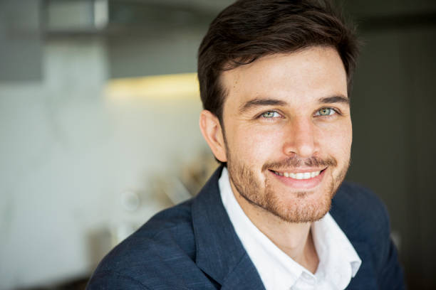 Portrait of young man Portrait of smiling young man in blazer hazel blue eyes stock pictures, royalty-free photos & images