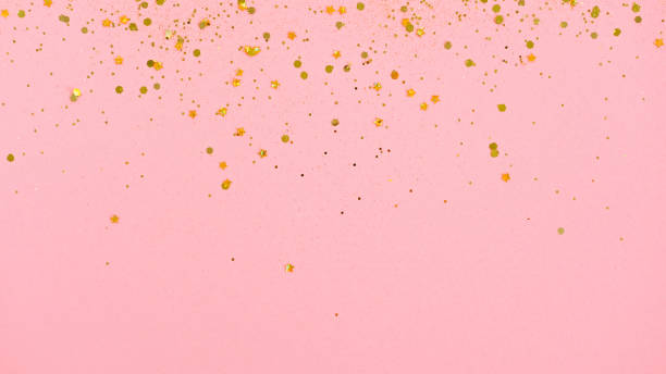 istock Gold glitter on pink background. Holiday abstract 1280100381