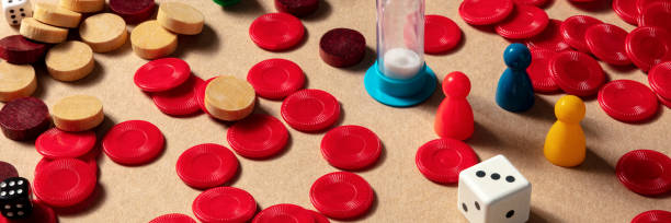 istock Board games panorama with multicolored pieces and dice 1280102905