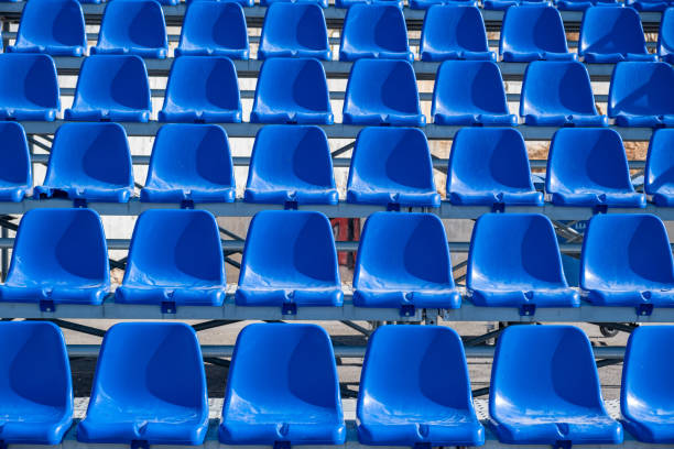 istock Stadium seats background. Rows of blue plastic empty chairs 1280103993