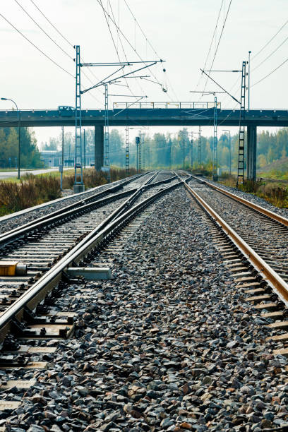 istock Two lane railroad with electric power lines 1280105794