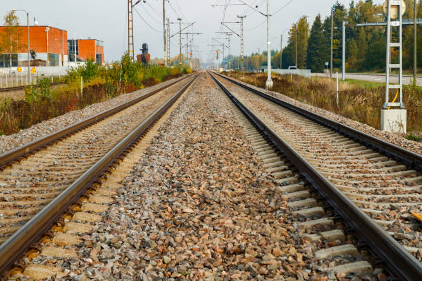 istock Two lane railroad with electric power lines 1280105801