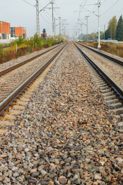 istock Two lane railroad with electric power lines 1280105815