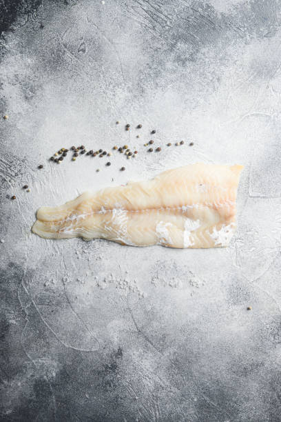 istock Cod fillets on a grey concrete background for the preparation of a healthy dish top view space for text 1280107779