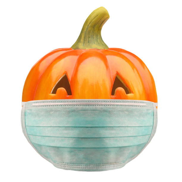 istock Jack O Lantern Halloween pumpkin with anti virus mask pandemic problem 1280107792