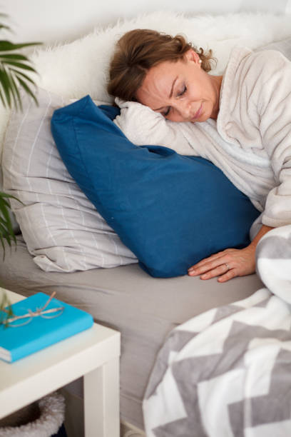 istock Mature woman sleeping in bed 1280107811