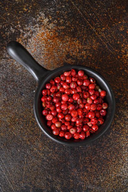 Dry Organic Red rose Peppercorns Ready to Grind Up top view overhead.