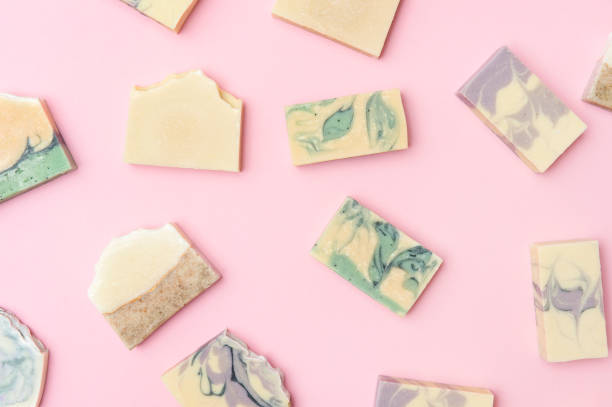 istock Hand made soap bars on pink color background, top view. Space for text. Zero waste concept 1280108678