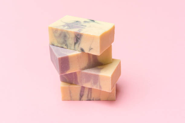 istock Hand made soap bars on pink color background, top view. Space for text. Zero waste concept 1280108679