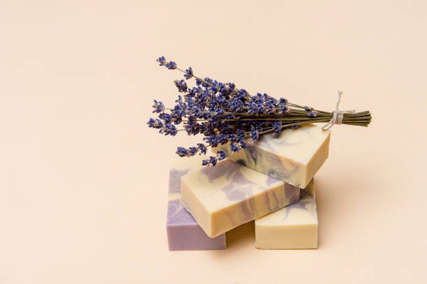 istock Natural handmade soap with dried lavender and essential oil on pink background. Zero waste concept 1280108971